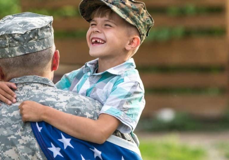 Indiana veteran receiving ptsd treatment hugs child